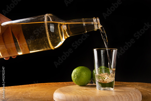 Brazilian drink known as Cachaça, drink from sugar cane. It is used in the preparation of the caipirinha known worldwide, selective focus.