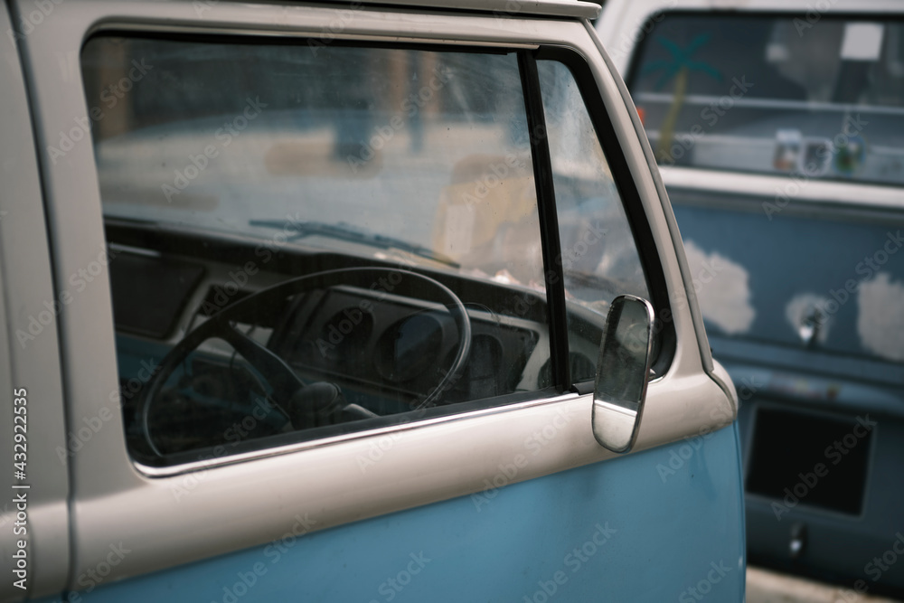 Close-up side view of a retro style vintage mini bus. Selective focus.