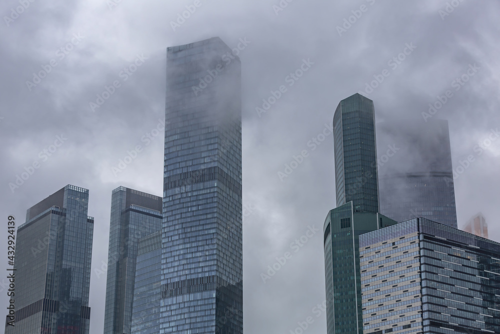 Glass skyscraper of the Moscow City business center in cloudy weather. Russia Glass skyscraper of the Moscow City business center in cloudy weather. Russia