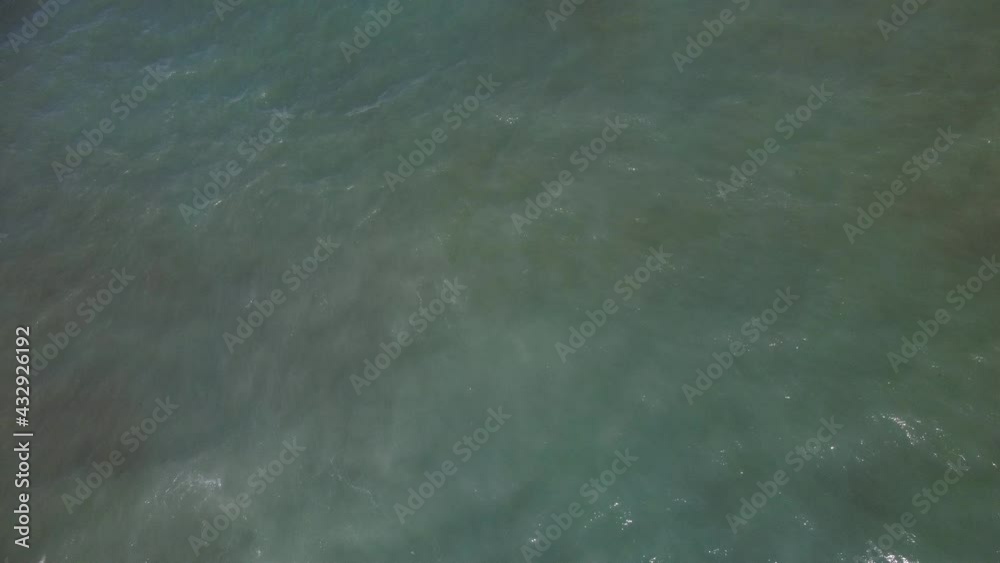 Following from above a wave that breaks in the rocks Following from above a wave that breaks in the rocks
