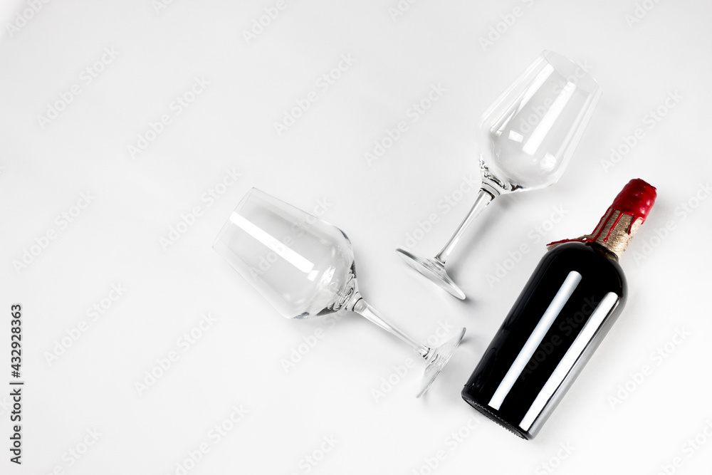 Wine bottle with two glasses on white background. Wine bottle mock up. Wine bottle with two glasses on white background. Wine bottle mock up.
