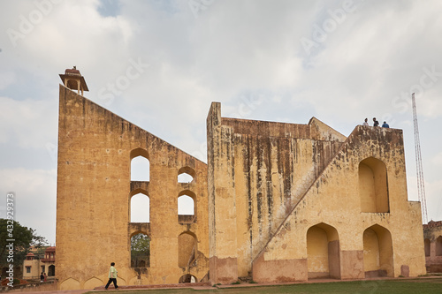 Translated from English-The Jantar Mantar is a collection of 19 astronomical instruments built by the Rajput king Sawai Jai Singh II, the founder of Jaipur, Rajasthan. Day.  photo