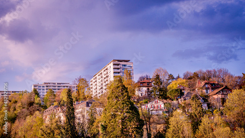 Panoramic view of high buildings and houses surrounded by trees. Lausanne, Switzerland.
