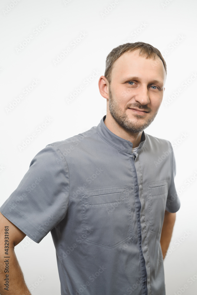 Portrait of friendly gray doctor in grey robe isolated over white background Portrait of friendly gray doctor in grey robe isolated over white background