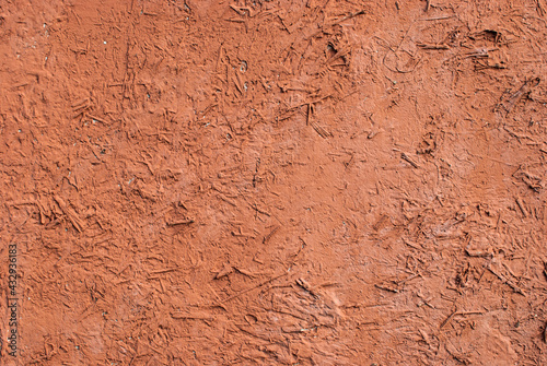 Old vintage adobe rustic style clay wall closeup as background