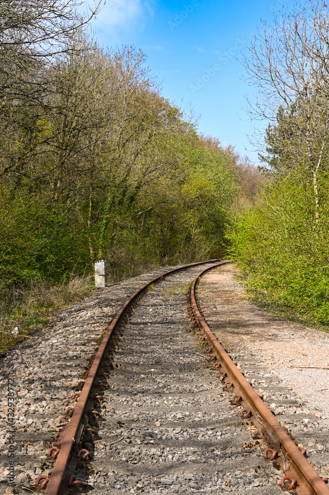 Single track branch line of a railway through a rural area. No people.
