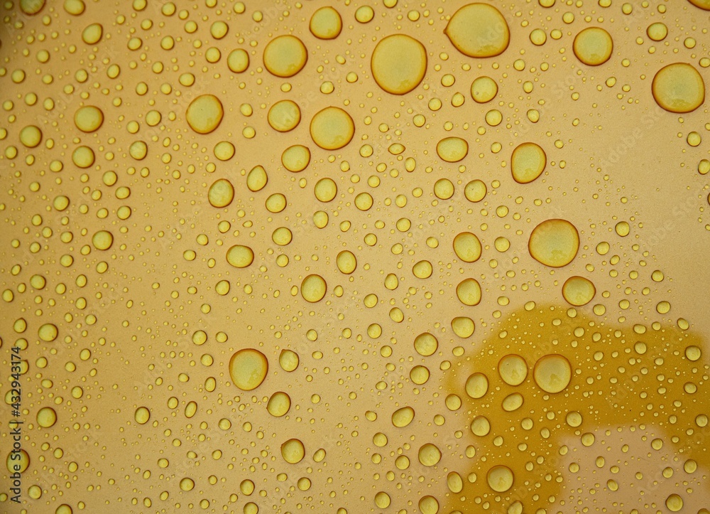 Hydrophobic effect on car varnish after using ceramic coating. Water drops on car Hydrophobic effect on car varnish after using ceramic coating. Water drops on car
