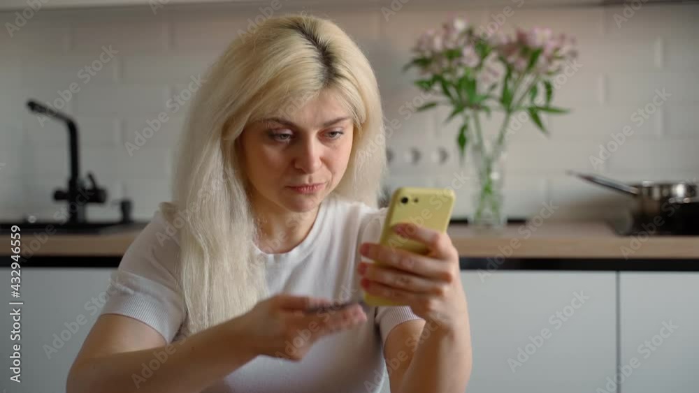 Young adult woman shopping online at home indoors. Girl customer client smile and happy ease of purchasing goods via the Internet using a credit card technologies Young adult woman shopping online at home indoors. Girl customer client smile and happy ease of purchasing goods via the Internet using a credit card technologies