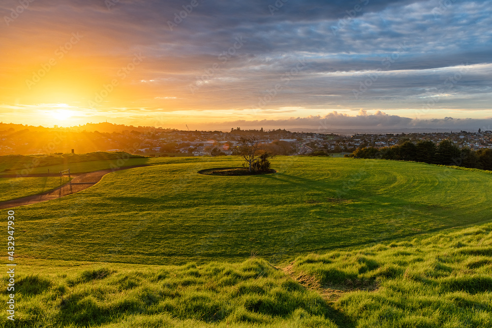 Burning sunrise over Auckland One Tree Hill, Mount Roskill New Zealand