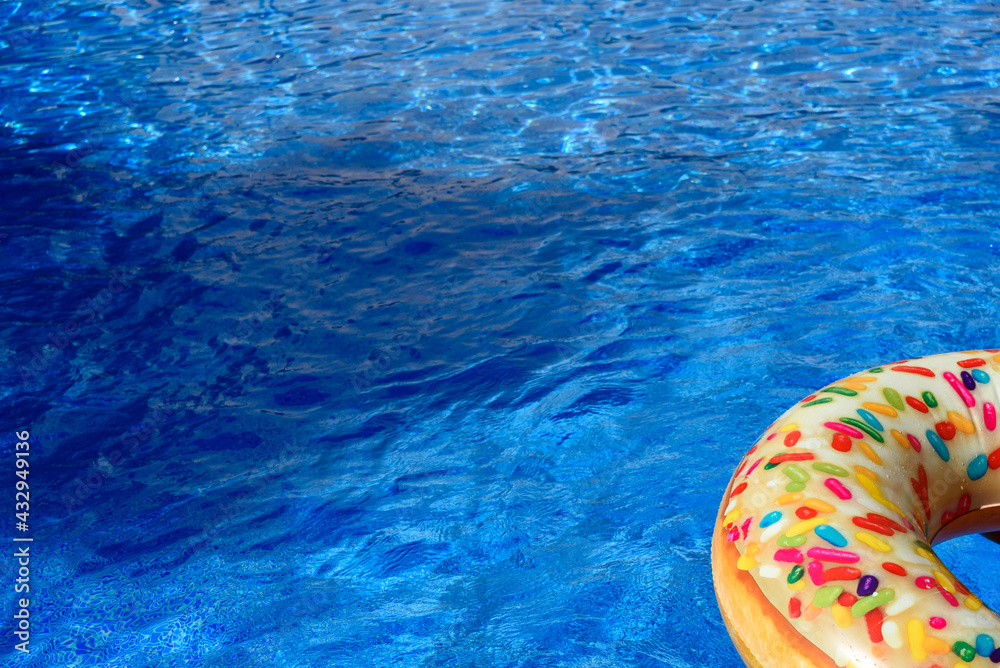 Detail with copy space of a round float in a pool with clean and refreshing waters, background with negative space for summer.