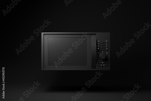 Black Microwave Oven floating on black background. minimal concept idea. monochrome. 3d render.