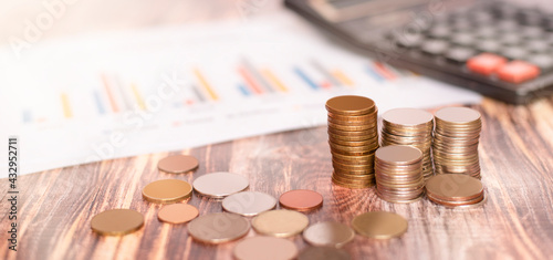 coin towers stand on a wooden table
