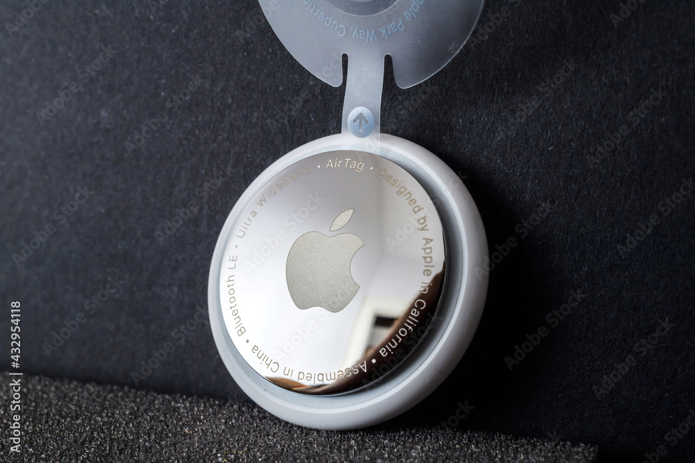Paris, France - May 2, 2021: Hero object shot of new AirTag with mirrror  back engravings ultra wideband and designed by Apple Computers in  California with logotype Bluetooth LE Stock Photo | Adobe Stock