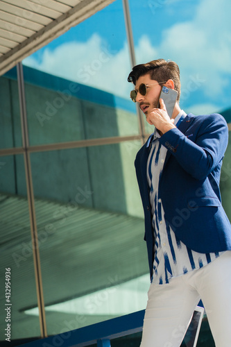 Businessman is thinking about the phone call he is having photo