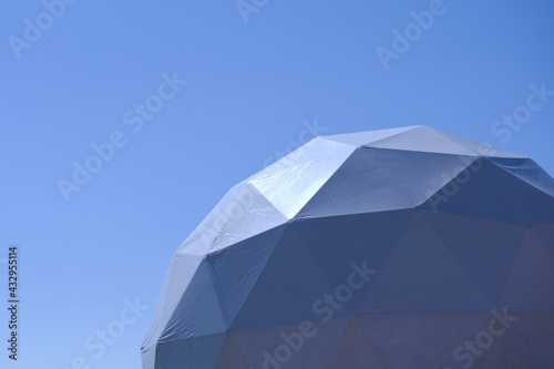 bright sunlight on ball made of metal frame covered with durable reflective material