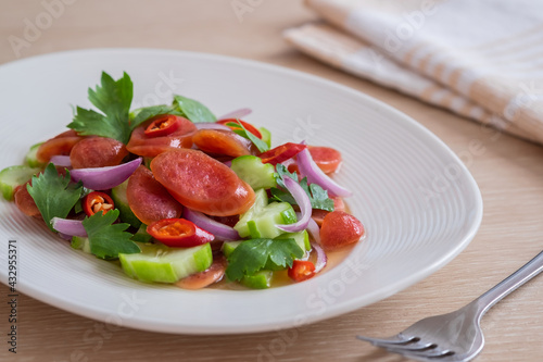 Spicy chinese pork sausage salad on plate, Thai food