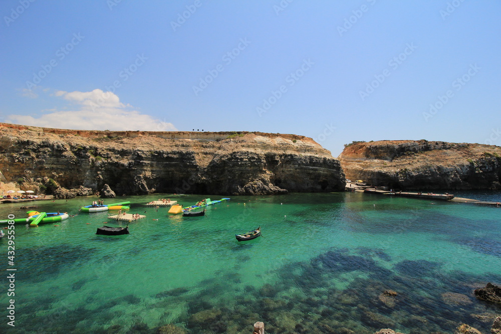cliffs at the coast with boats