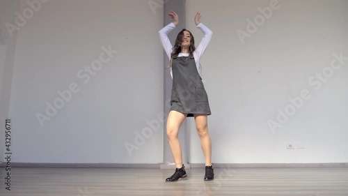 girl dances in front of the camera showing synchronism and coordination