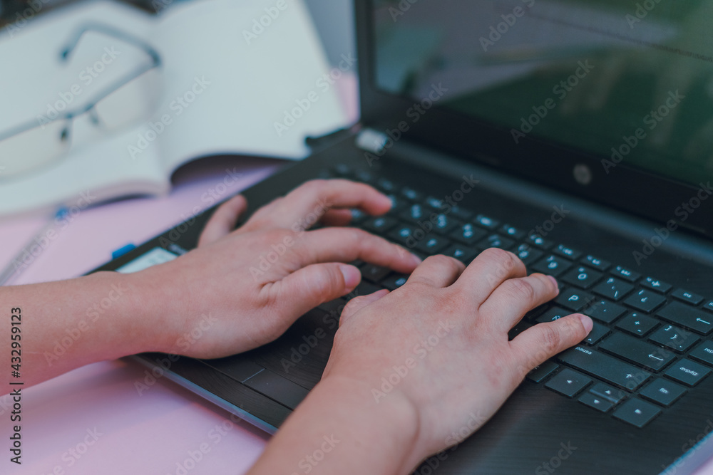 I work on laptop with glasses and notes in the background I work on laptop with glasses and notes in the background