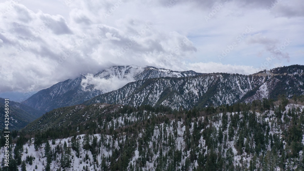 Aerial view in Big Bear, California of clouds rolling into the mountains 