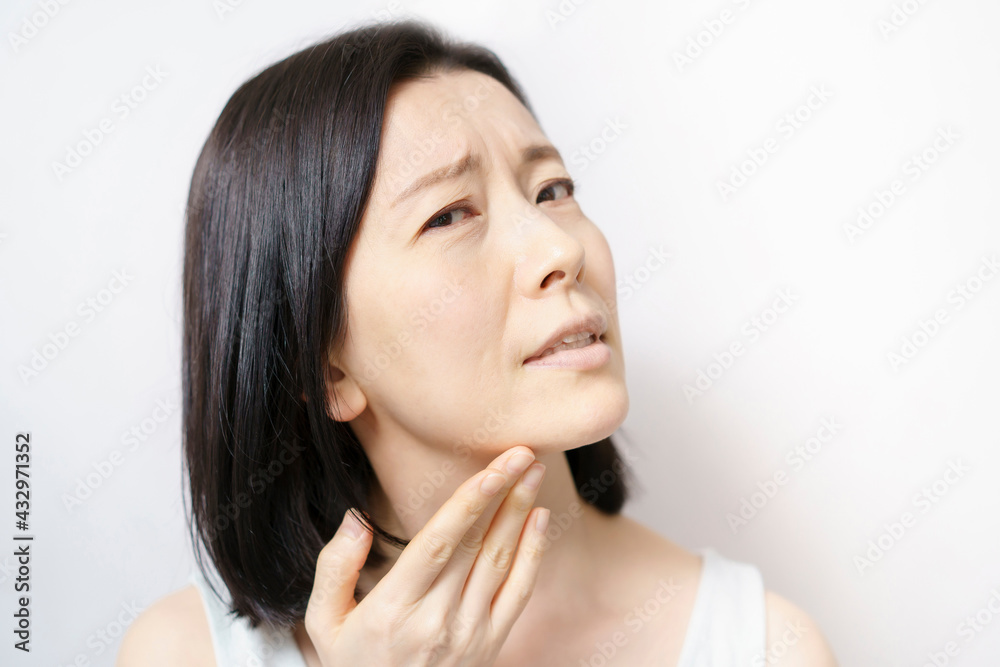 Middle-aged woman suffering from skin problems Middle-aged woman suffering from skin problems
