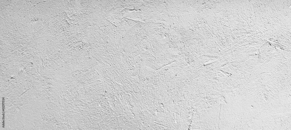 Fototapeta premium Panorama of The exterior cement wall of the building is painted white with a rough surface texture and background seamless