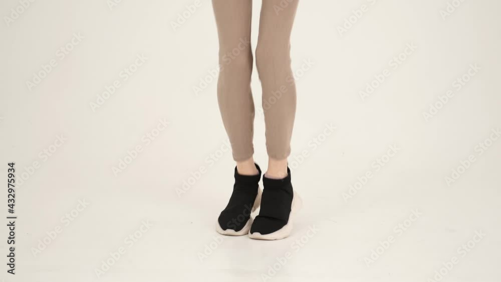Young sportive woman with skipping rope isolated on white Young sportive woman with skipping rope isolated on white