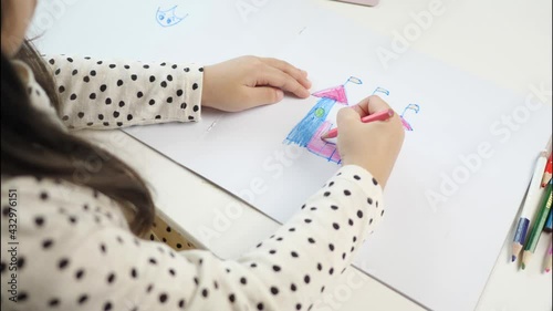 Asian children study art at home.coloring castle on paper