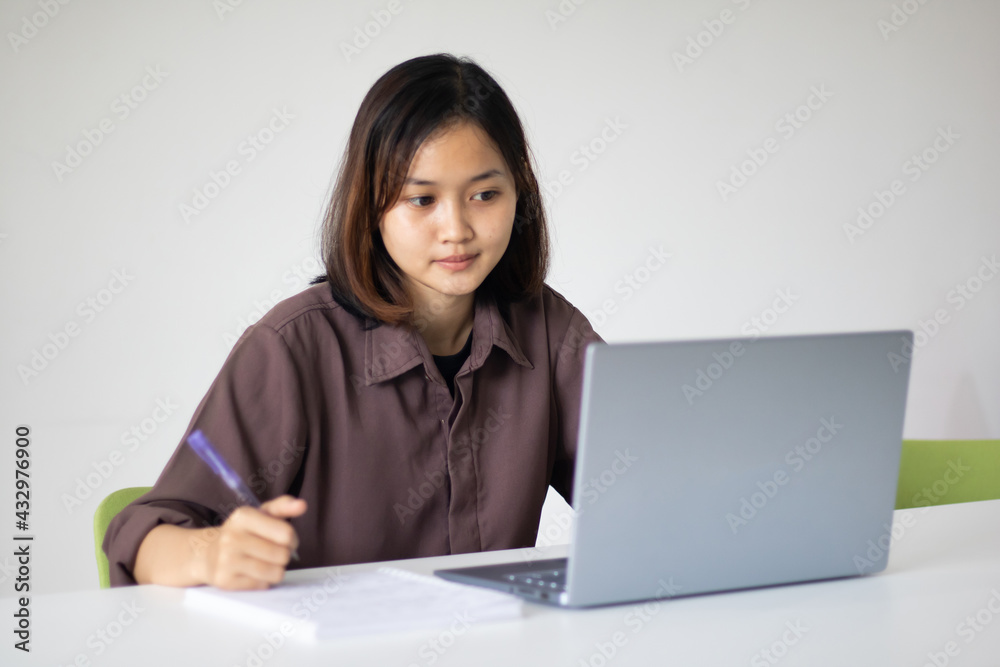 Portrait of beautiful young woman working in the office. Portrait of beautiful young woman working in the office.