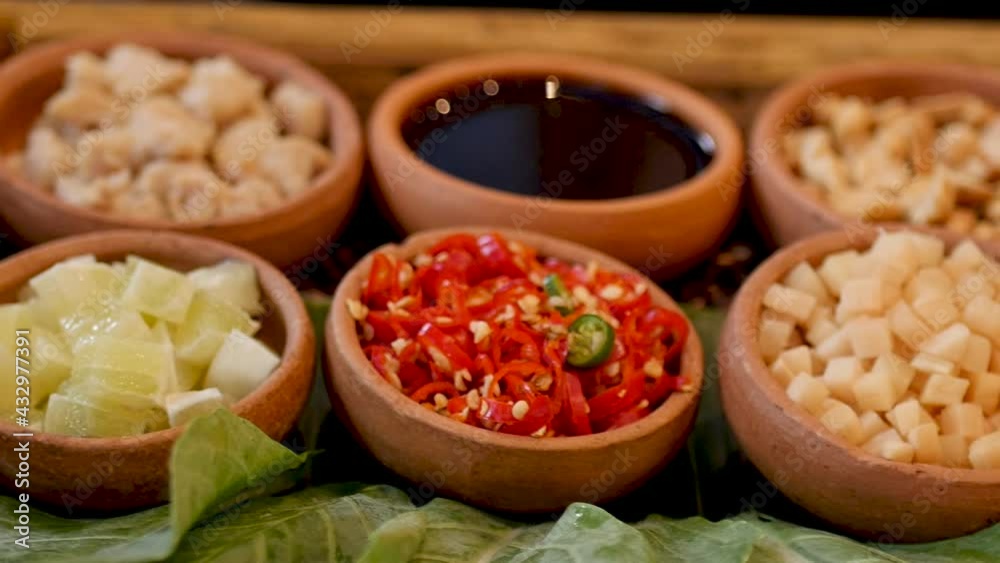 Miang kham - A royal leaf wrap appetizer. Miang kham - A royal leaf wrap appetizer.