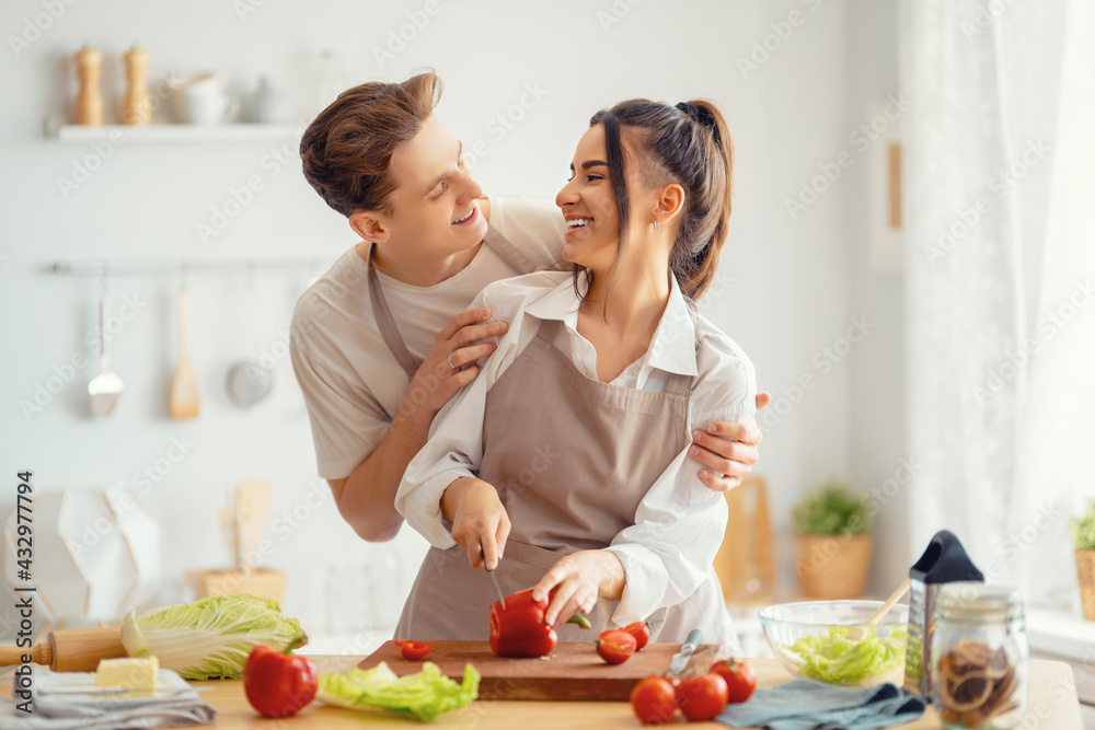 loving couple is preparing the proper meal loving couple is preparing the proper meal
