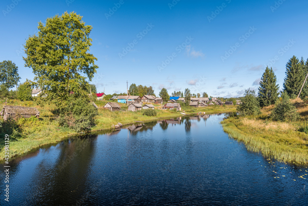 A Karelian village on a river in Russian north