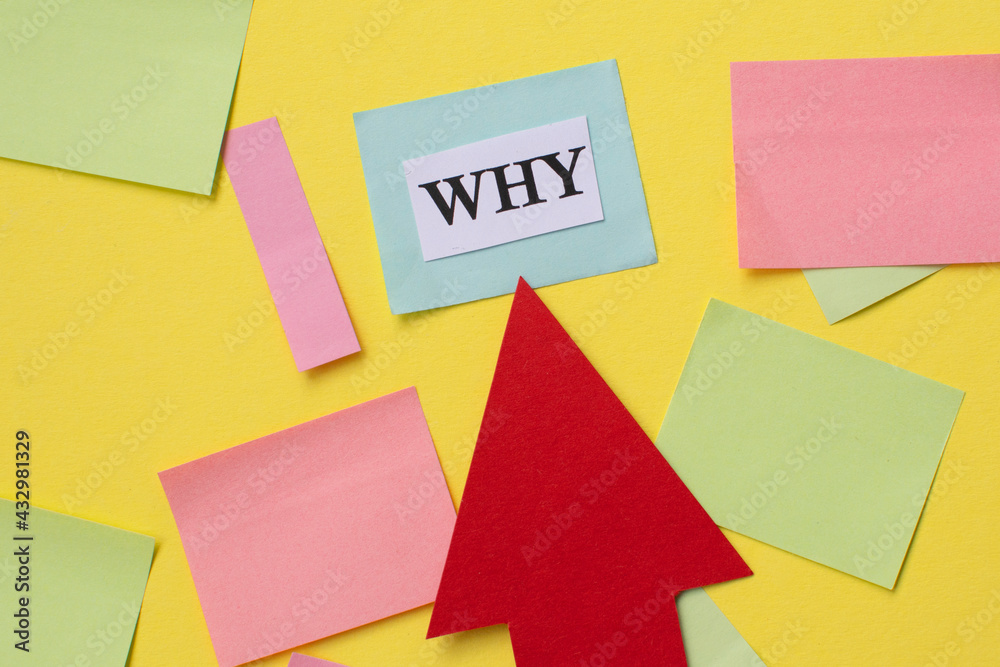 the red arrow points to the word why on a yellow background one with colorful stickers. Concept of questions, motivation and inspiration the red arrow points to the word why on a yellow background one with colorful stickers. Concept of questions, motivation and inspiration
