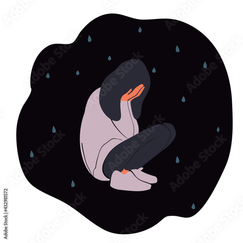 Sad and crying girl squatting on the floor