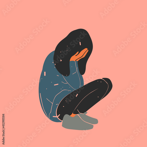 Sad and crying girl squatting on the floor