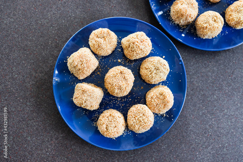 vegan arancini risotto balls with tomato sauce filling, healthy plant-based food photo