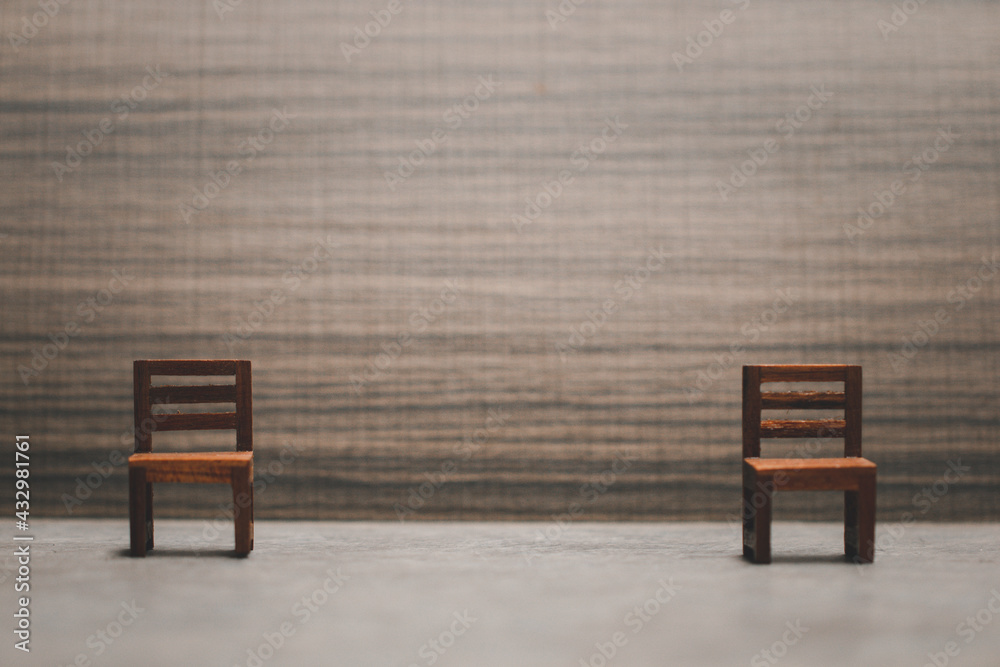 empty two wooden chair with space for social distancing concept empty two wooden chair with space for social distancing concept
