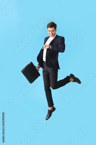 Jumping man with briefcase ...