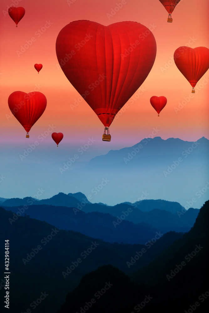 Fototapeta premium Red Heart hot air balloons flying over blue mountains landscape in twilight sky, valentine concept
