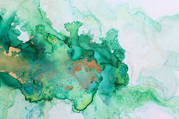 art photography of abstract fluid painting with alcohol ink, green and gold colors