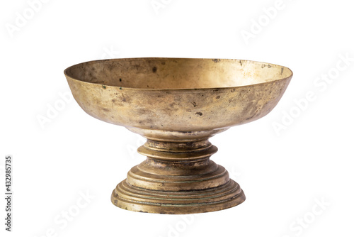 Old brass tray with pedestal isolated on white background.