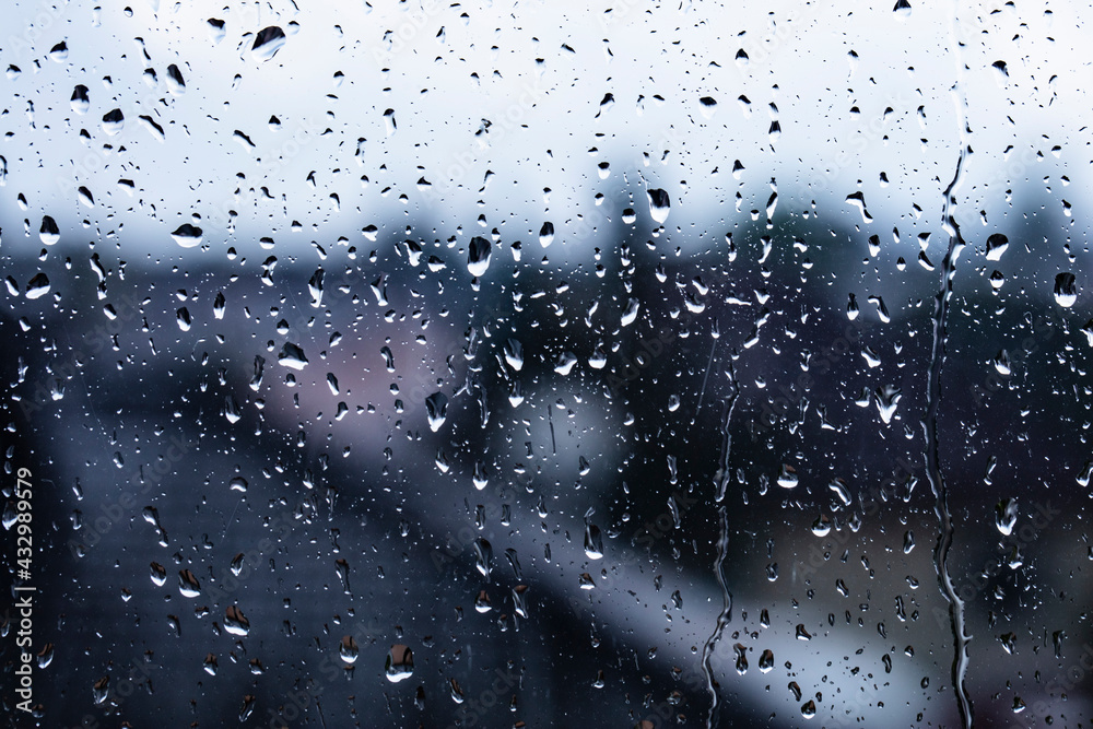 rainy day.rain drops on the window surface rainy day.rain drops on the window surface