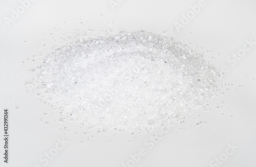 handful of crystalline citric acid on white