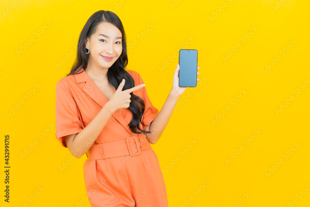 Portrait beautiful young asian woman smile with smart mobile phone Portrait beautiful young asian woman smile with smart mobile phone
