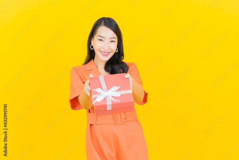 Portrait beautiful young asian woman smile with red gift box Portrait beautiful young asian woman smile with red gift box