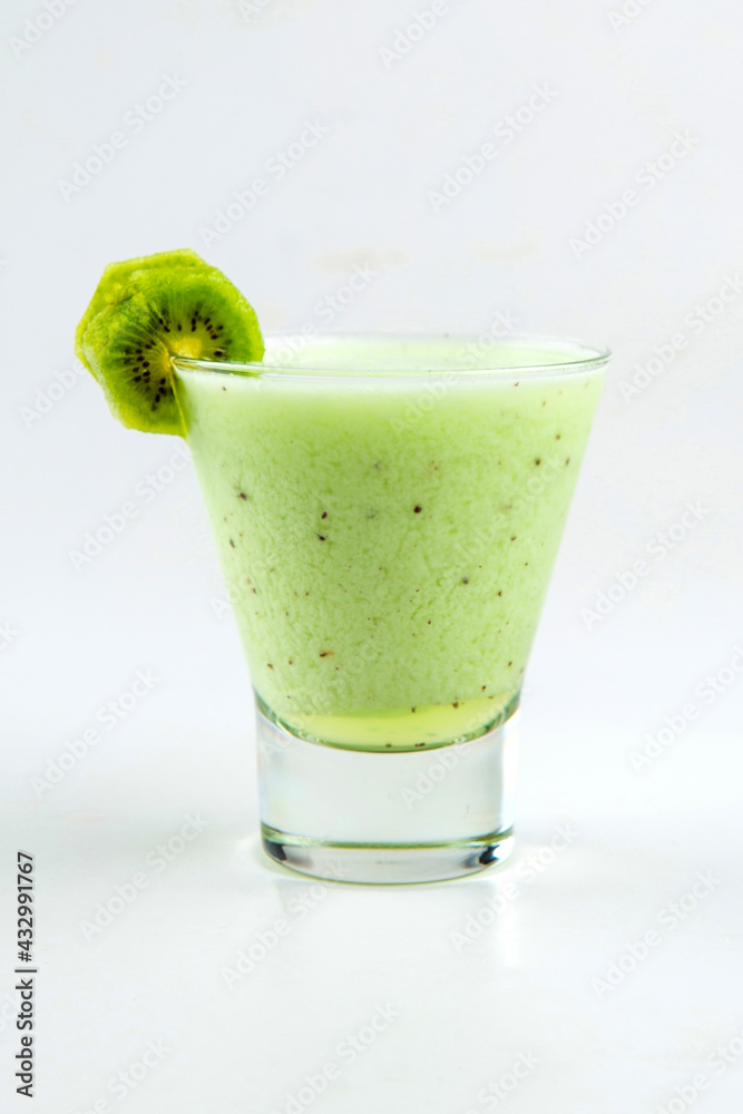 Isolated glass of fresh kiwi smoothie on the white background Isolated glass of fresh kiwi smoothie on the white background