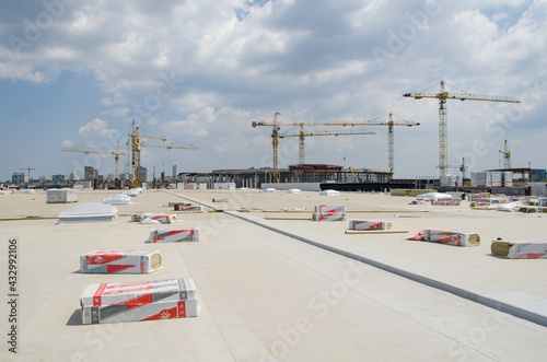 Construction of unexploited membrane-covered building roof photo