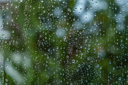 rainy day.heavy rain falling on the window surface