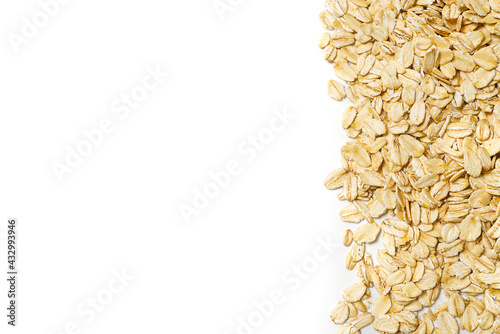 Oat flakes on a white isolated background copy space. oat flakes border