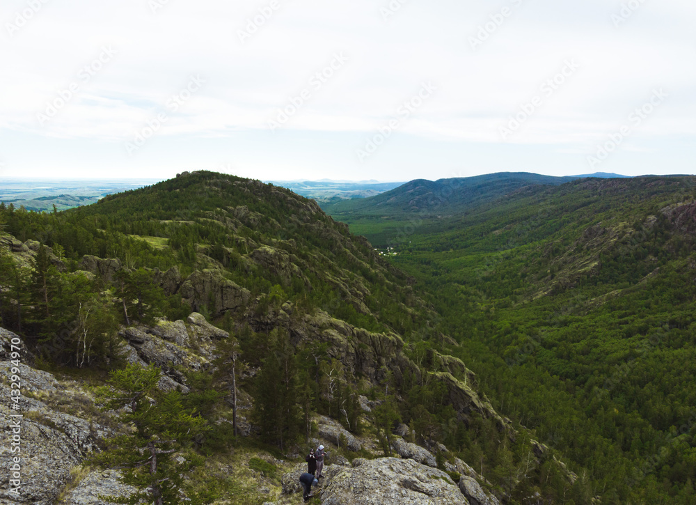 Fototapeta premium evergreen fir forest on a hilltop among the mountains of the National Park of the Republic of Bashkortostan on Lake Bannoye